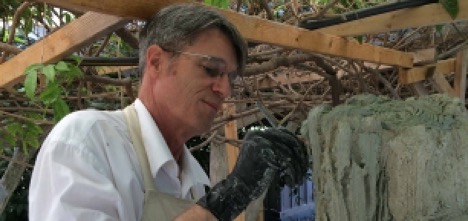Terry Eagan sculpting concrete faux bois bark texture.