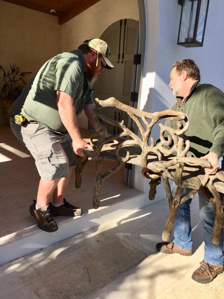 Emile and friend installing one part of the faux bois bench