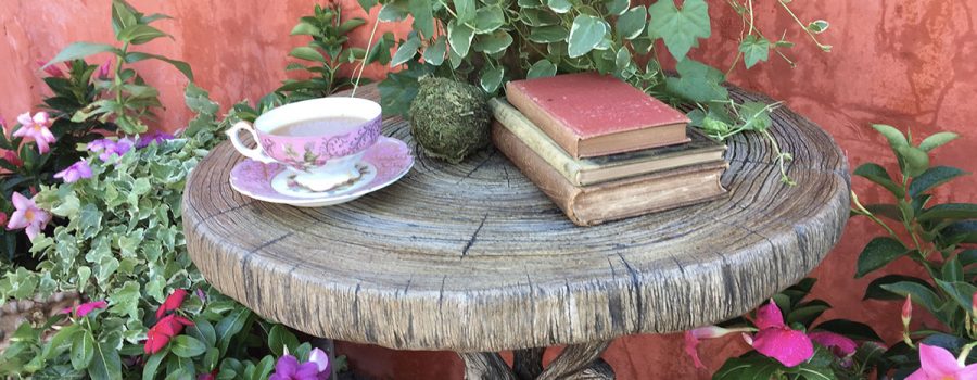Faux bois table with teacup and books
