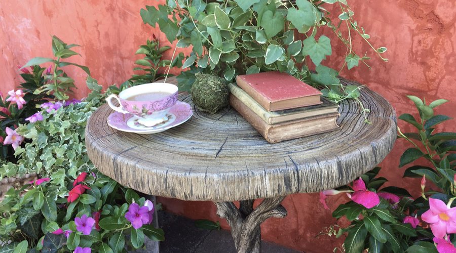 Faux bois table with teacup and books