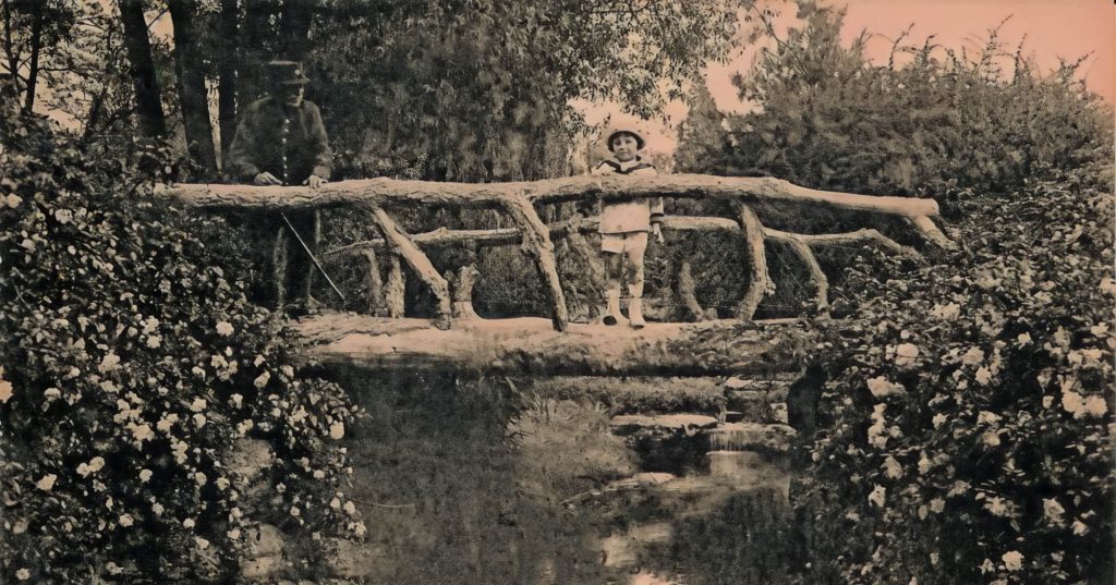 child on faux bois bridge in France