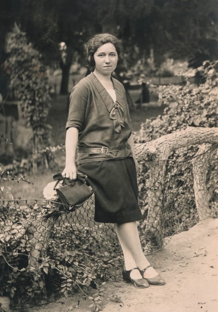 fashionable young 1920s woman with faux bois bridge