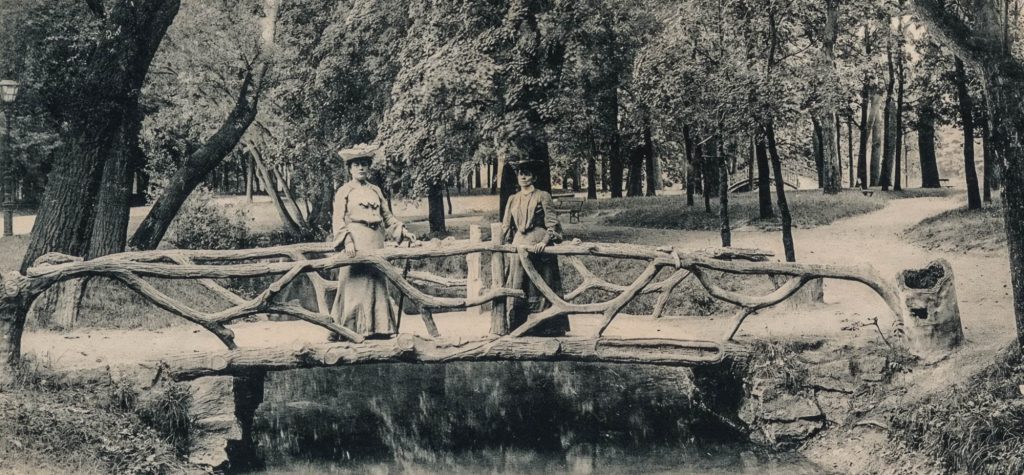 victorian ladies on a faux bois bridge