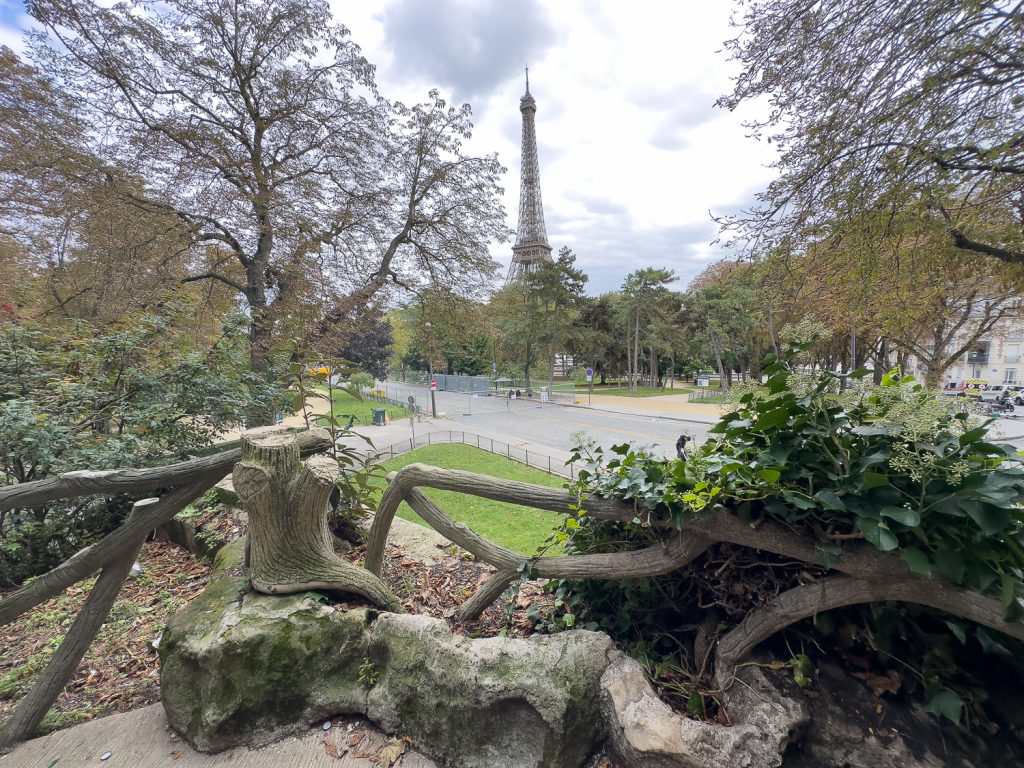 Paris park with faux bois balcony and railings near Eiffel Tower and Monument à de Grasse