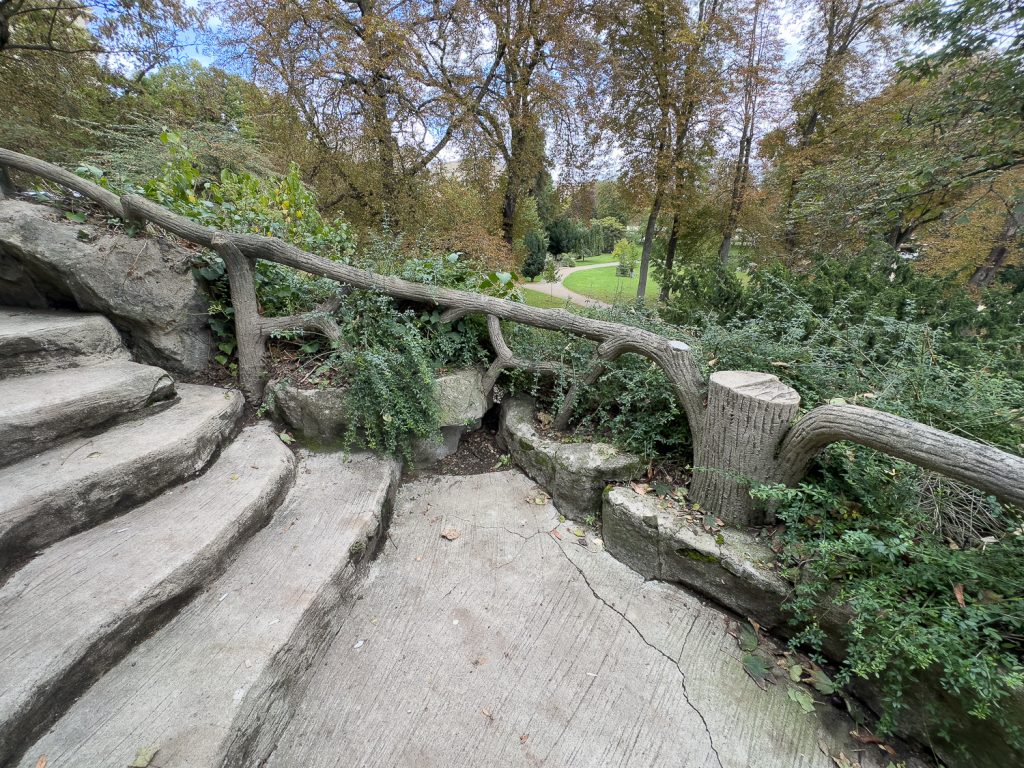 Paris park with faux bois balcony and railings near Eiffel Tower and Monument à de Grasse