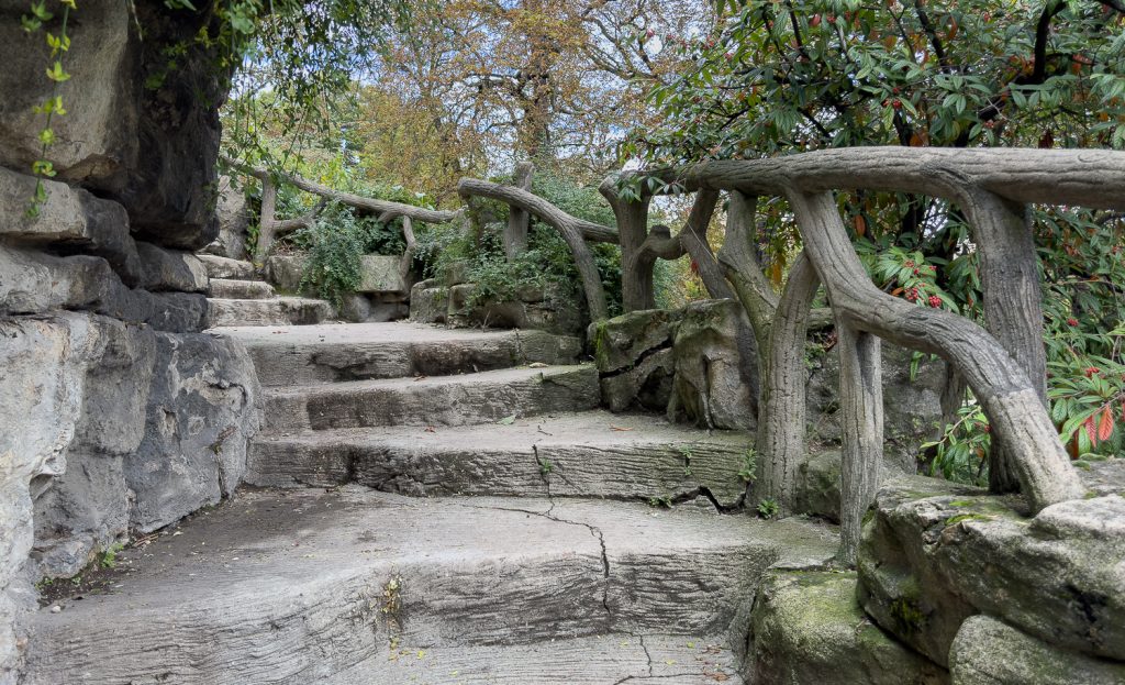 Paris park with faux bois balcony and railings near Eiffel Tower and Monument à de Grasse