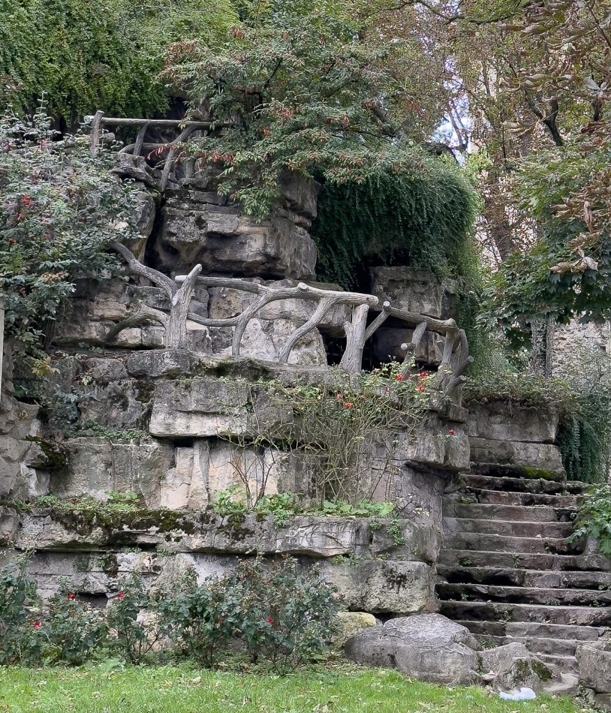 Paris park with faux bois balcony and railings near Eiffel Tower and Monument à de Grasse