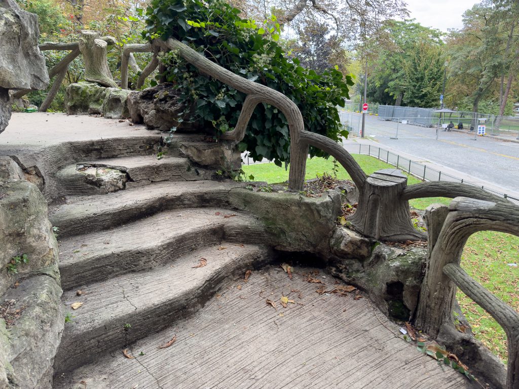 Paris park with faux bois balcony and railings near Eiffel Tower and Monument à de Grasse