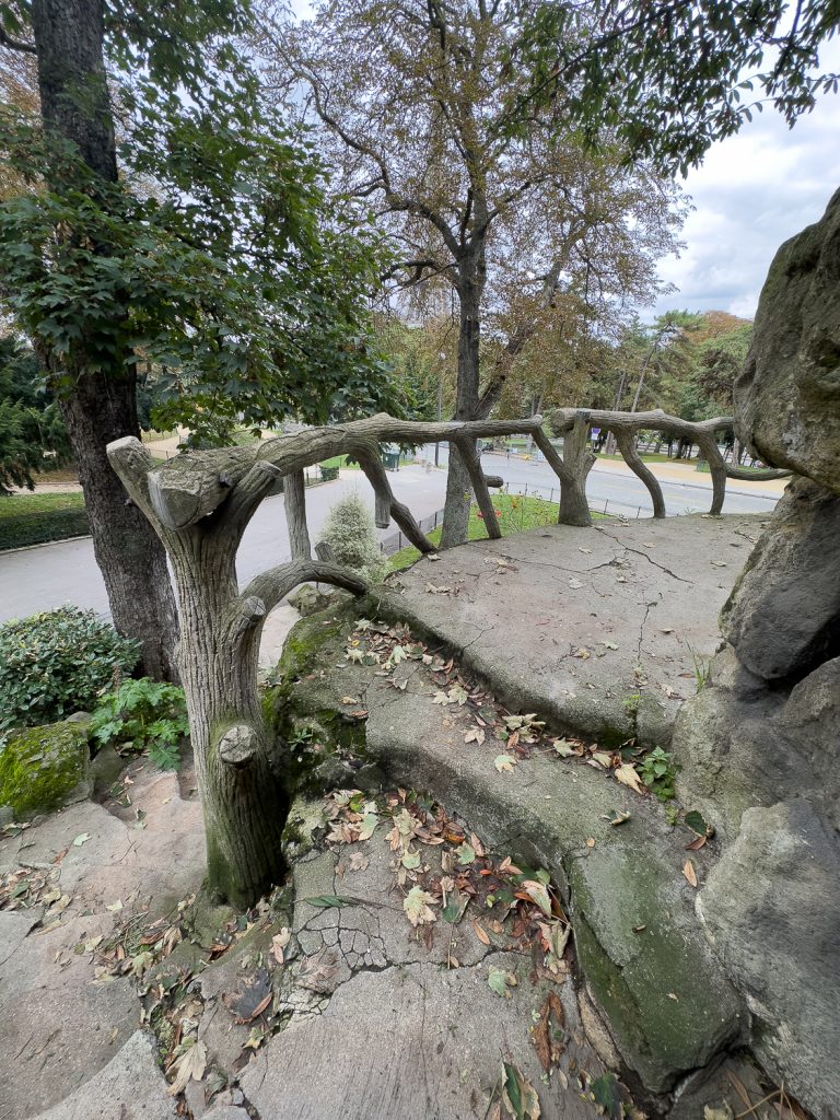 Paris park with faux bois balcony and railings near Eiffel Tower and Monument à de Grasse