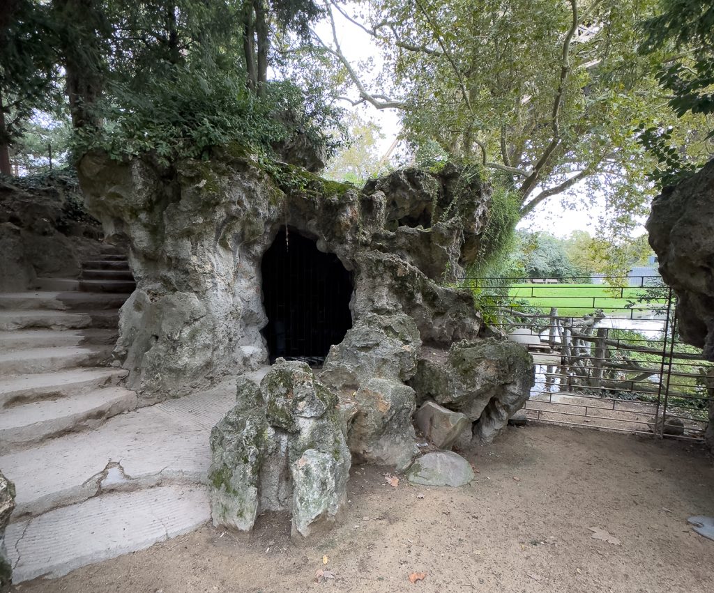 Old faux bois fences and grotto near base of Eiffel Tower