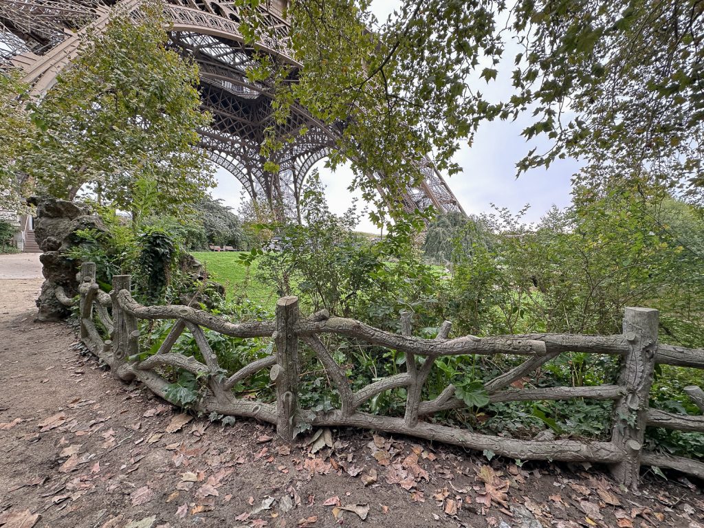 Old faux bois fences near base of Eiffel Tower