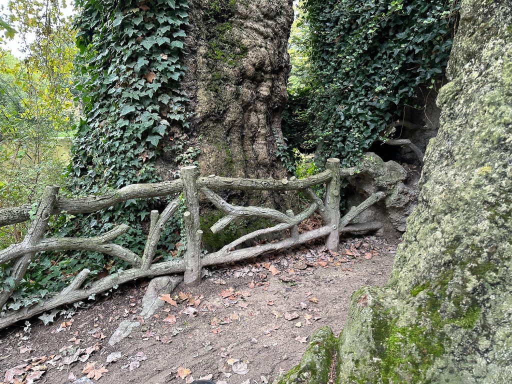 Old faux bois fences near base of Eiffel Tower with 200-year-old sycamore tree