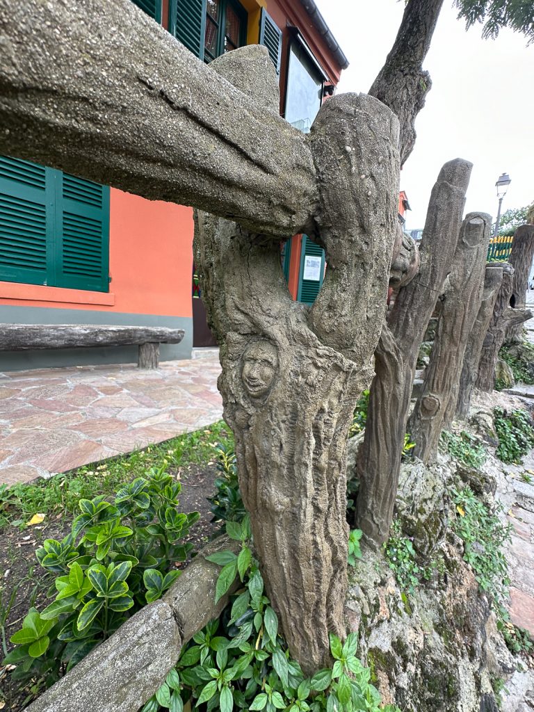 a rustic faux bois courtyard fence detail at Au Lapin Agile