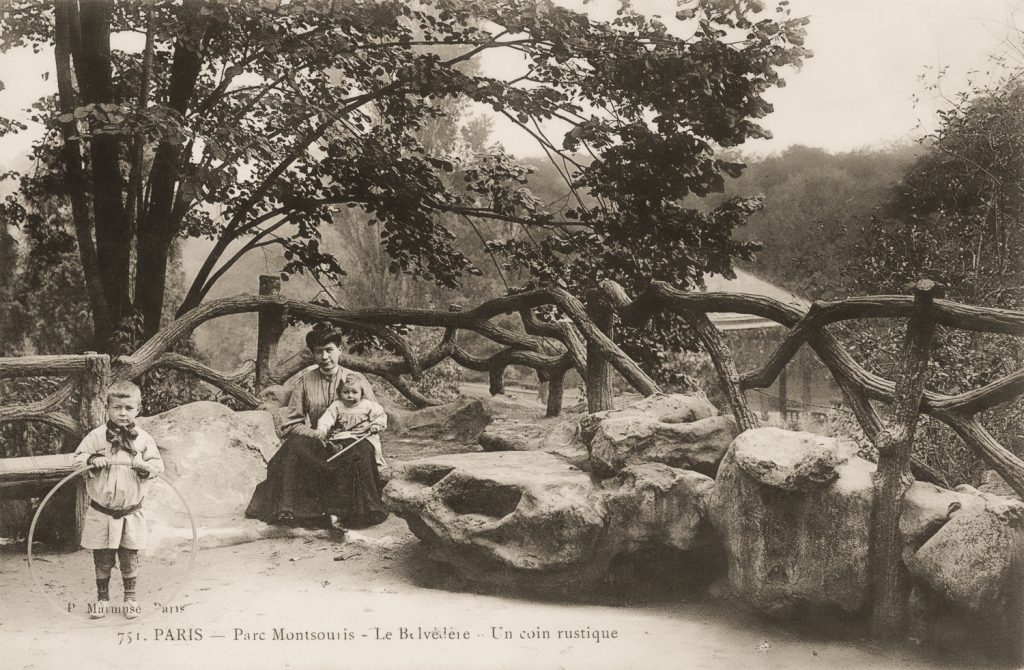 A faux bois railing above the cascade at Parc Montsouris